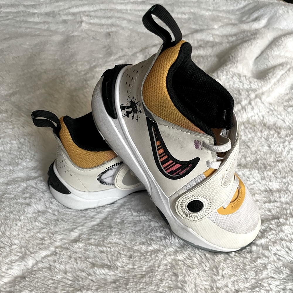 White/Volt/Black kid’s Nike basketball sneakers